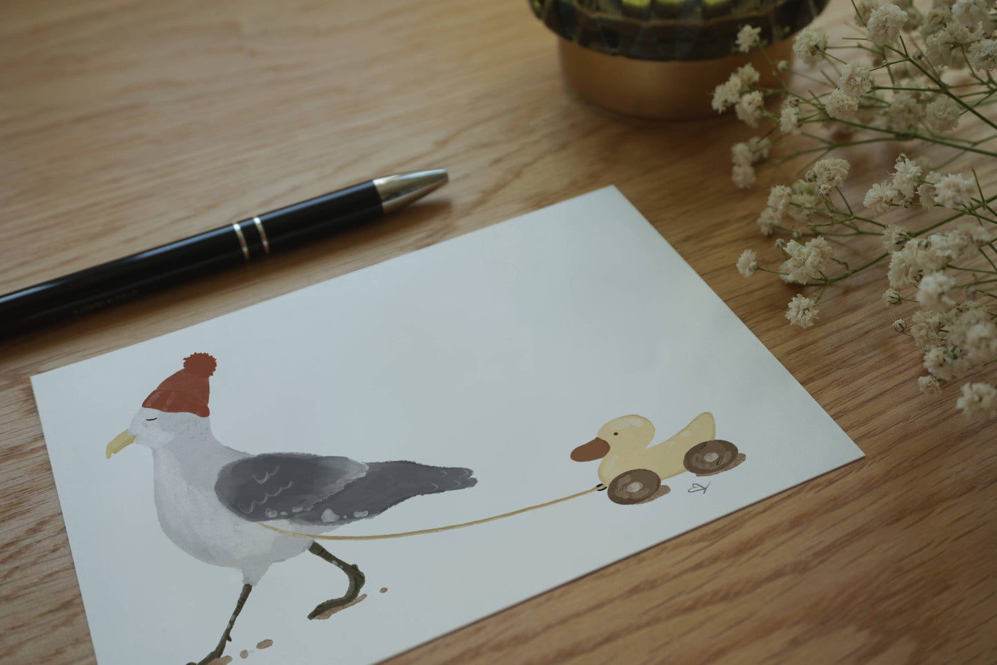 Postkarte Möwe spaziert mit Ente A6